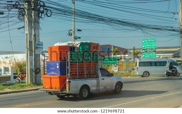 Editorial use\
only; a pickup truck carrying colorful storage boxes, taken at\
Samut Sakhon, Thailand, in March,\
2018.