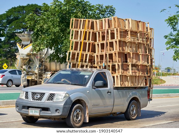 Editorial use only; a pickup truck loaded with new\
wooden chairs and tables, taken at Sakon Nakhon, Thailand, in\
November 2020.