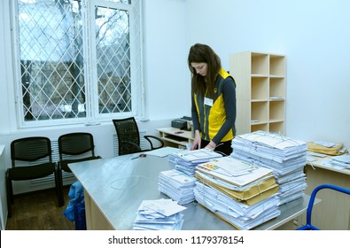 Editorial Use Only. At The Post Office, Sorting Room: Female Postal Worker In Uniform Sorting Letters And Parcels Standing At The Work Table. April 10, 2018. Kiev, Ukraine