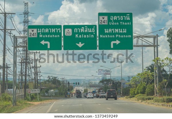 Editorial use\
only; road signs over a highway in rural Thailand, taken in Sakon\
Nakhon, Thailand, in October\
2018.