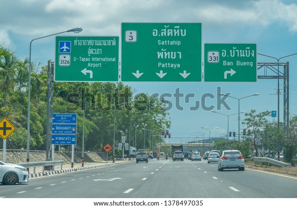 Editorial use only; road signs over a\
highway, taken at Rayong, Thailand, in April\
2019.