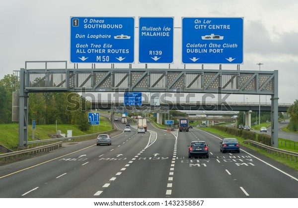Editorial\
use only; road signs over a motorway giving traffic directions,\
taken at Dublin city, Ireland in October\
2017.