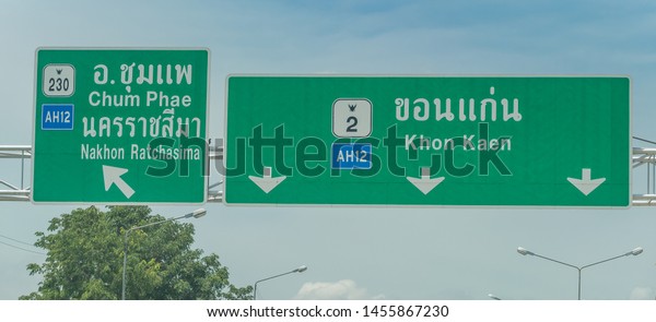 Editorial use only;\
road signs with directions arrows, over a road, taken at Khon Kaen,\
Thailand, in July\
2019.