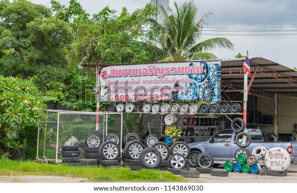 Editorial use only; a roadside garage selling new\
and used car tires, taken outside Mahachai, Samut Sakhon, Thailand,\
on July 27th, 2018.
