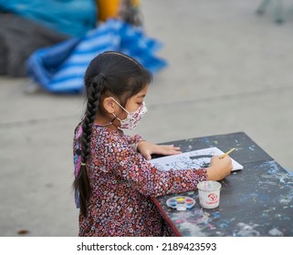 Editorial Use Only; A Small Girl Wearing A Face Mask While Drawing And Painting At An Outdoor Market, Taken At Pathumthani, Thailand, In December 2021.      