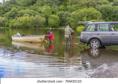 Editorial use only; towing a boat from the lake and hitching to a car trailer, taken at Loch Gowna, Co. Cavan, Ireland, on July 20th, 2017.