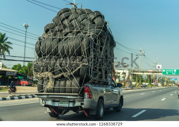 Editorial\
use only; a truck carrying a very large load of used car tires,\
taken at Phetchabun, Thailand in December\
2018.