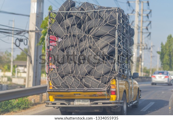 Editorial use only; a truck full\
of used car tires, taken at Pathumthani, Thailand, in March\
2019.