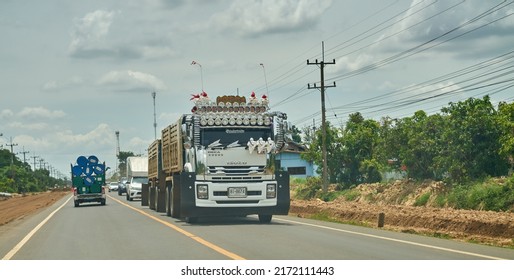 Editorial use only; a truck with many headlamps on a rural road, taken at Sisaket, Thailand, in June 2022. 