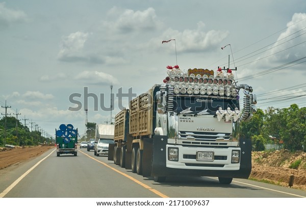 Editorial use only; a\
truck with many headlamps on a rural road, taken at Sisaket,\
Thailand, in June 2022.\
