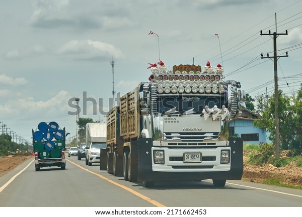 Editorial use only; a\
truck with many headlamps on a rural road, taken at Sisaket,\
Thailand, in June 2022.\
