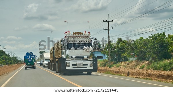 Editorial use only; a
truck with many headlamps on a rural road, taken at Sisaket,
Thailand, in June 2022.
