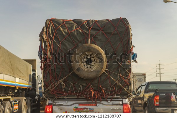 Editorial use only; a truck with a spare wheel
strapped to the back of it, taken at Pathumthani, Thailand, in
October, 2018.