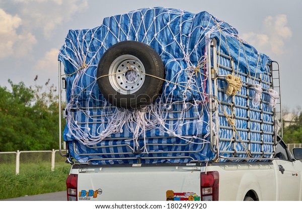 Editorial use only; a truck with a spare\
wheel strapped to the back of it, taken at Pathumthani, Thailand,\
in October, 2019.                              \
