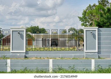 Editorial Use Only;  A Wall And Iron Railings Perimeter To A Private Residence, Taken At Sisaket, Thailand, In June 2022.