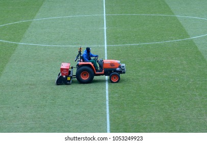 Editorial Use Only. Worker Sits On A Tractor Cleaning Lawn On A Football Field Of The Olympic National Sports Complex Stadium. March 16,2018. Kiev, Ukraine 