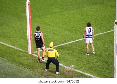 Editorial,Australian Rules Football Geelong And The Saints Indoor Under Lights. Umpire Gets In Position For Score