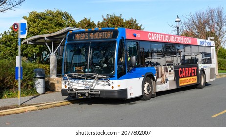 Edmonds, WA, USA - November 17, 2021; Community Transit Bus At A Stop In Edmonds.  The Digital Reader Board Informs Masks Mandatory For Riders