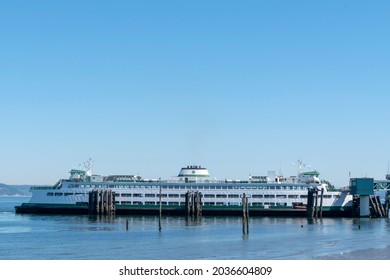 EDMONDS, WASHINGTON, USA - Jun 26, 2021: The Washington State Ferry Walla Walla at Edmonds Dock loads passengers and cars. 