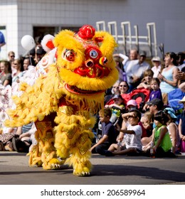 EDMONTON, AB, CANADA-July 18, 2014: People performing in Chinese dragon costumes as seen in the K-Days Parade on July 18th, 2014.