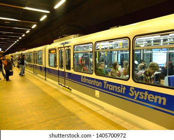 Edmonton, Alberta, Canada - 18th October 2016 - Edmonton metro station with train and passengers