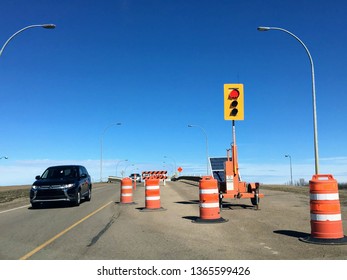 Edmonton, Alberta, Canada - April 7th, 2019: A Temporary Traffic Light Turned Red At A Construction Site For Bridge Renovations In Edmonton, Alberta, Canada.  Spring Time Is The Start Of Construction.