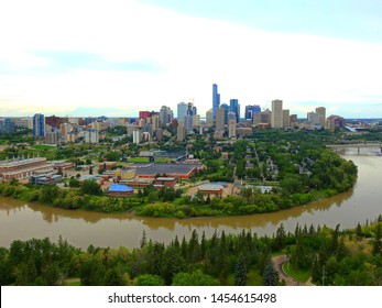 Edmonton, Alberta, Canada - July 2019: Edmonton Downtown Summer Skyline Just Before Sunset At The Day Hour Showing River Valley Parks, Saskatchewan River And Surrounding Skyscrapers. 