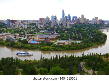 Edmonton, Alberta, Canada - July 2019: Edmonton Downtown Summer Skyline Just Before Sunset At The Day Hour Showing River Valley Parks, Saskatchewan River And Surrounding Skyscrapers. 