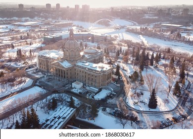 Edmonton, Alberta - December 05, 2020: Winter Aerial View Of The Legislature In Edmonton, Alberta, At Sunrise. It's A Blue Sky Day With Snow Covering The Ground. Walterdale Bridge Is In The Background