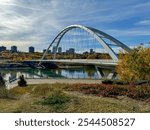 Edmonton, Alberta - October 13, 2024: Views of the Edmonton skyline with the Walterdale Bridge over the North Saskatchewan River in the foreground
