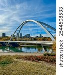 Edmonton, Alberta - October 13, 2024: Views of the Edmonton skyline with the Walterdale Bridge over the North Saskatchewan River in the foreground
