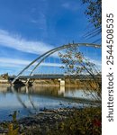 Edmonton, Alberta - October 13, 2024: Views of the Edmonton skyline with the Walterdale Bridge over the North Saskatchewan River in the foreground
