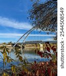 Edmonton, Alberta - October 13, 2024: Views of the Edmonton skyline with the Walterdale Bridge over the North Saskatchewan River in the foreground
