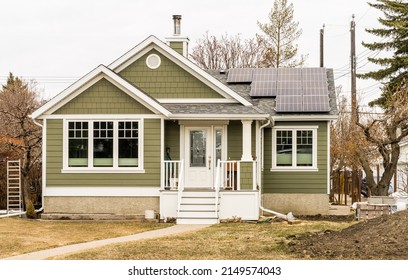 Edmonton, Canada, April 21, 2022: View Of An Old House Renovetion With Installation Of Solar Batteries In Early Spring Season