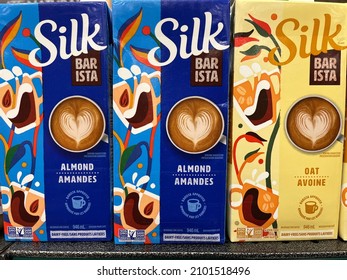 Edmonton, Canada - December 27, 2021: Cartons Of Silk Non-dairy, Gluten-free Barista Almond And Oat Milk On Display On A Grocery Store Shelf