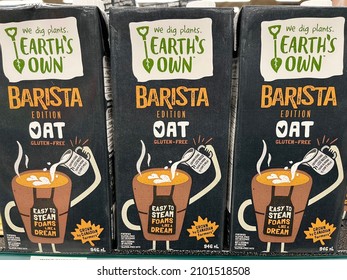 Edmonton, Canada - December 27, 2021: Cartons Of Earth's Own Non-dairy, Gluten-free Barista Edition Oat Milk On Display On A Grocery Store Shelf