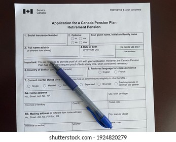 Edmonton, Canada - February 15, 2021: A Service Canada Application For A Canada Pension Plan Retirement Pension With A Pen On It 