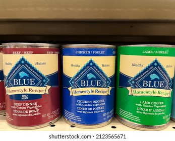 Edmonton, Canada - January 31, 2022: Tin Cans Of Various Flavours Of Blue Buffalo Dog Food On Display On A Pet Store Shelf