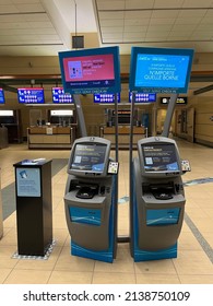 Edmonton, Canada - March 21, 2022: Two Self Check In Kiosks And A Sanitization Stand In The Edmonton International Airport