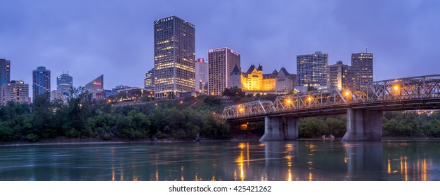 EDMONTON, CANADA - MAY 20: Panorama of Edmonton's skyline  at dusk on May 20, 2016 in Edmonton, Alberta. The Saskatchewan River is in the foreground and a traffic bridge is on the right.