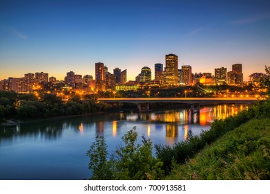 Edmonton downtown, James Macdonald Bridge and the Saskatchewan River at night, Alberta, Canada. Long exposure.