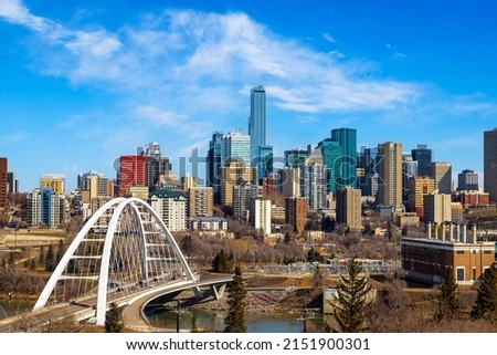 Edmonton downtown skyline showing Walterdale Bridge across Saskatchewan River and surrounding skyscrapers. Edmonton is the capital of Alberta, Canada.