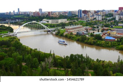 Edmonton Downtown Summer Skyline Just Before Sunset At The Day Hour Showing River Valley Parks, Walterdale Bridge Across Saskatchewan River And Surrounding Skyscrapers. 