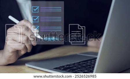 E-document management Paperless workplace, e-signing, electronic signature, document management man signs an electronic document on digital document by virtual notebook screen using a stylus pen.