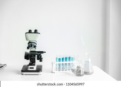 Educate Background, Science Tool Is Sampling A Chemical Extract On Table, Research And Develop Background, Scientific Lab Concept With Effect Filter.