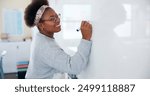 Education, black woman and teacher with whiteboard in classroom for writing, learning or explain with knowledge. Educator, person and happy with brainstorming for exam, assessment and study in school