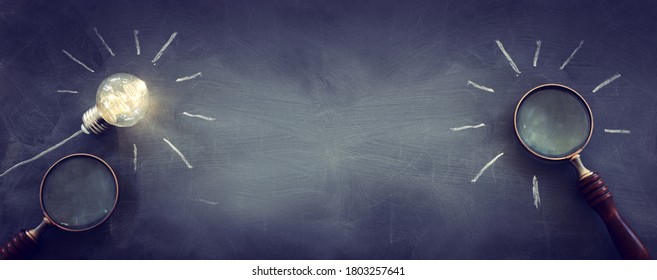 Education and business concept image. Creative idea and innovation. light bulbs as metaphor over blackboard background