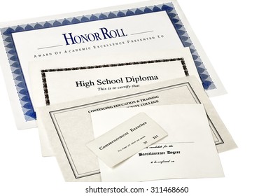 Education Certification Documents Including High School Diploma,commencement Ticket, Continuing Education Certificate And Honor Roll Certificate  Isolated On White