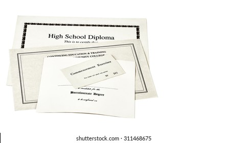 Education Certification Documents Including High School Diploma,commencement Ticket, And Continuing Education Certificate Isolated On White