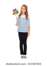 Education, Childhood And Ecology Concept - Child With Colorful Windmill Toy